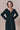 Black long-sleeve dress with refined button details