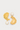 Gold sculptural stud earrings with stone detail