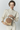Beige & multico leather bag with passementerie details