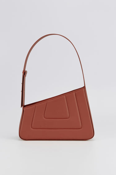 Rust asymmetric leather quilted bag